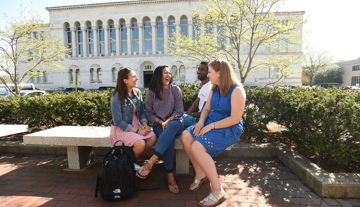 Students talking in front of library