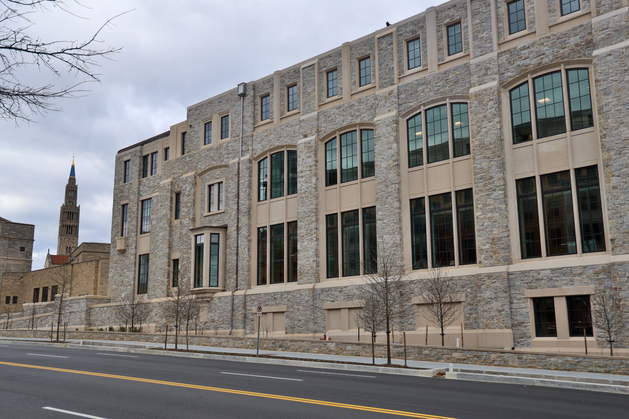 Prospective students and families tour the campus of The Catholic University of America during the Open House event, with faculty and staff warmly engaging with attendees.