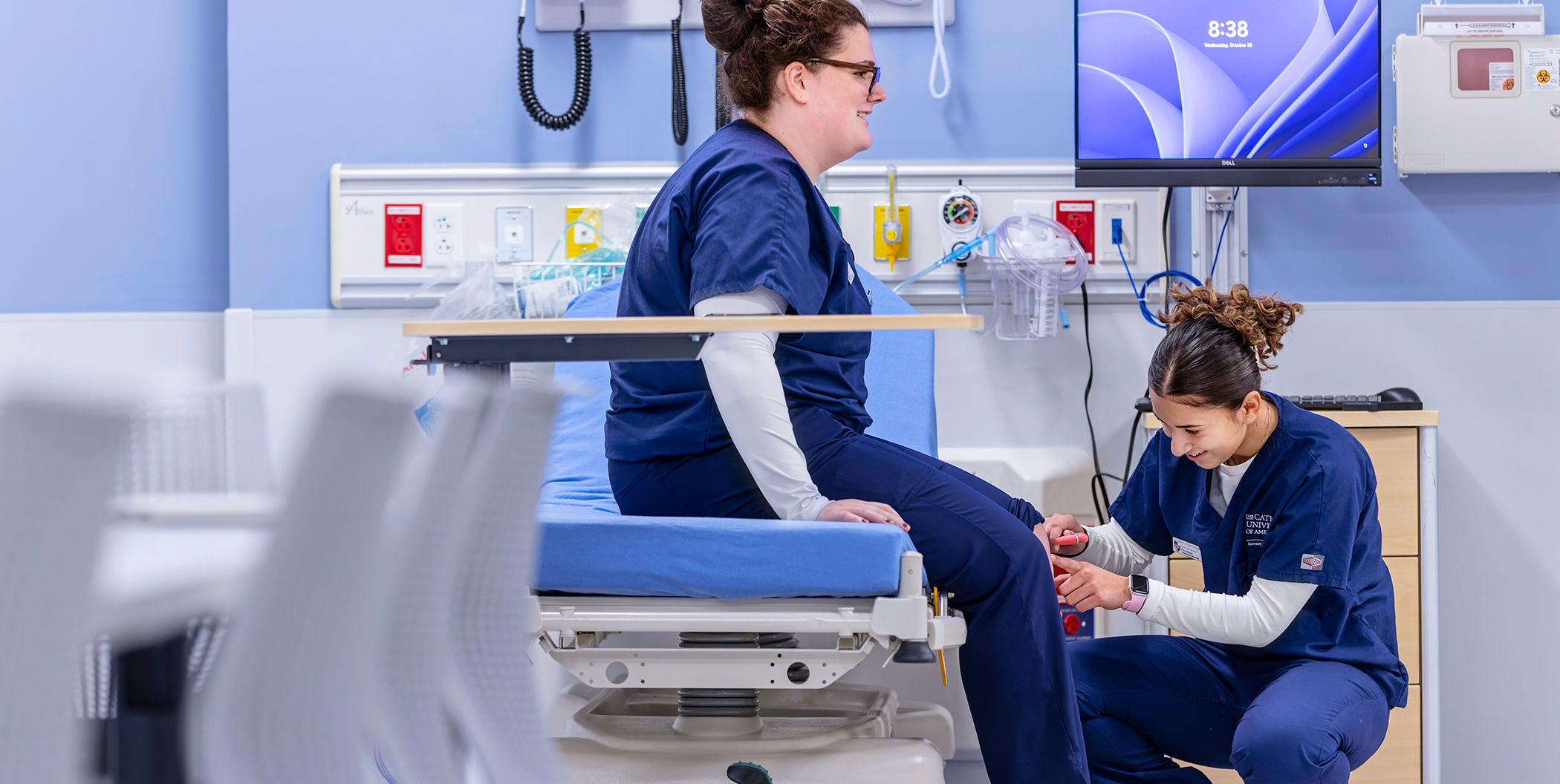 Nursing students practicing in the simulation room.