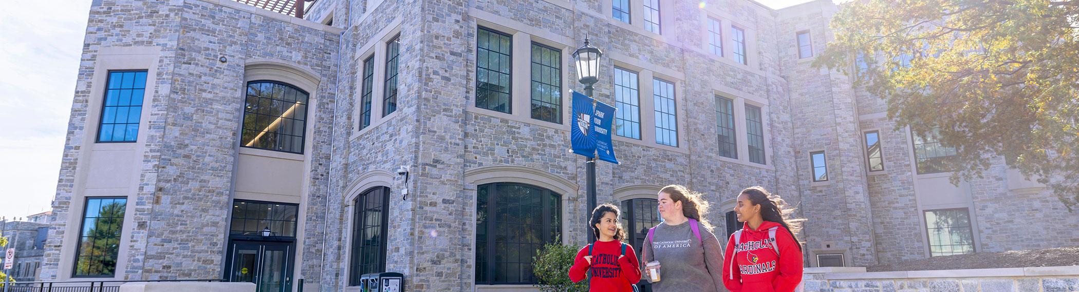 Students walking in front of the Conway Building.