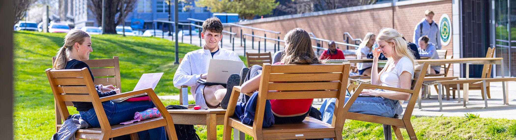 Students studying near the Pryz in the center of campus.