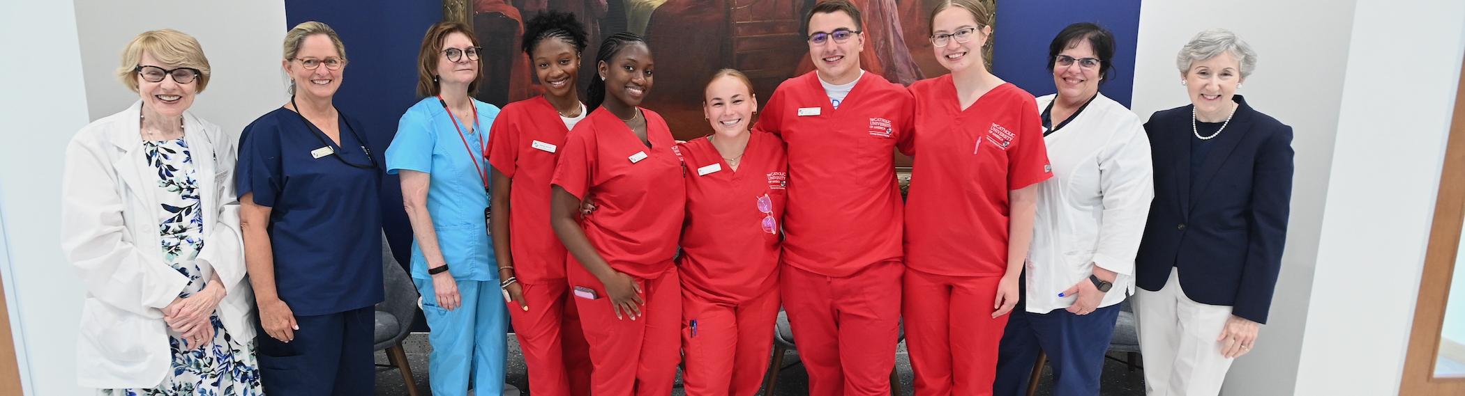 nursing students and faculty pose for a picture