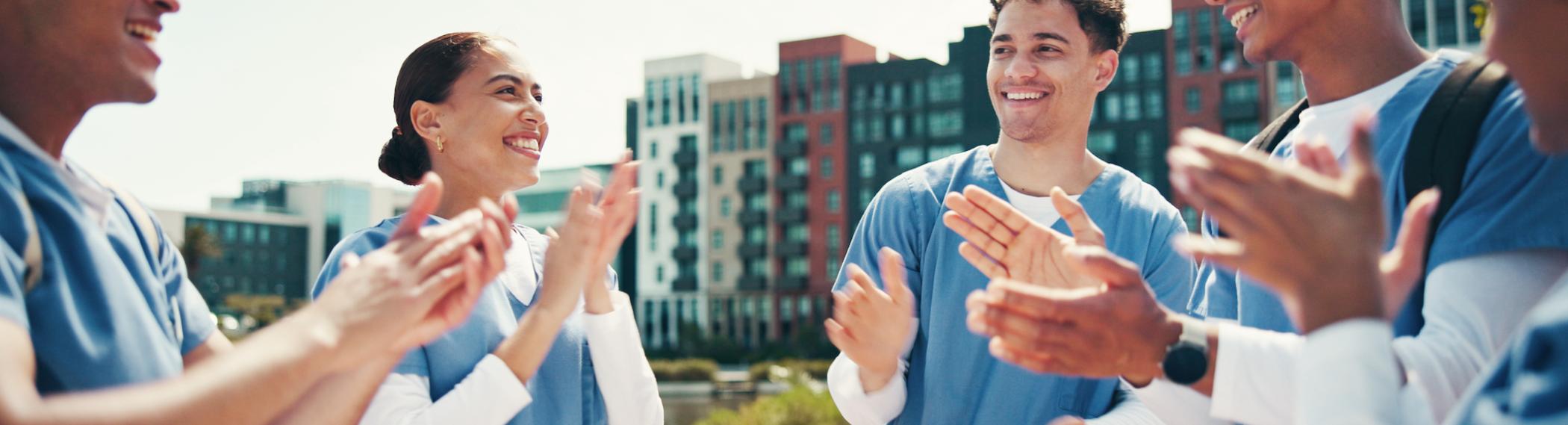 nursing residents smilling and clapping