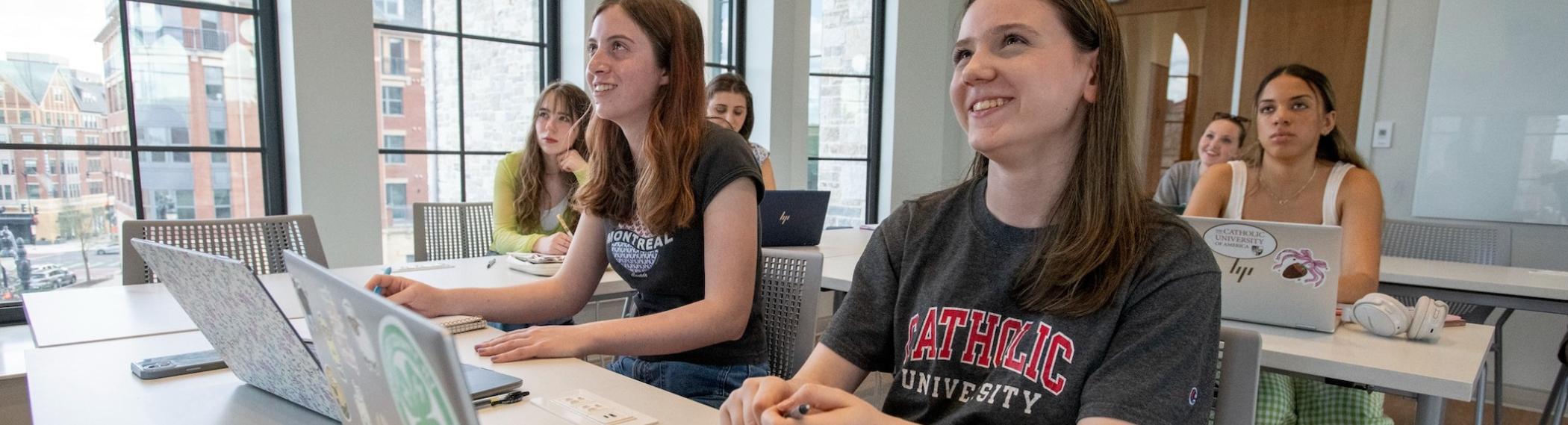 students in a light-filled classroom with vaulted ceilings in the nursing building