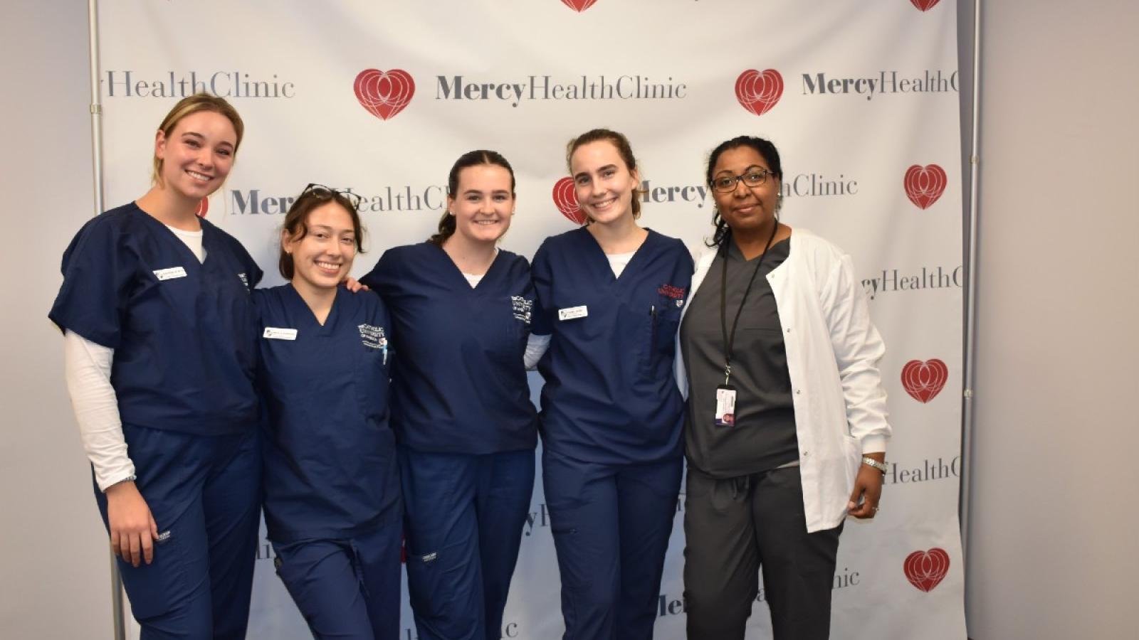 natalia with her nursing friends in their scrubs