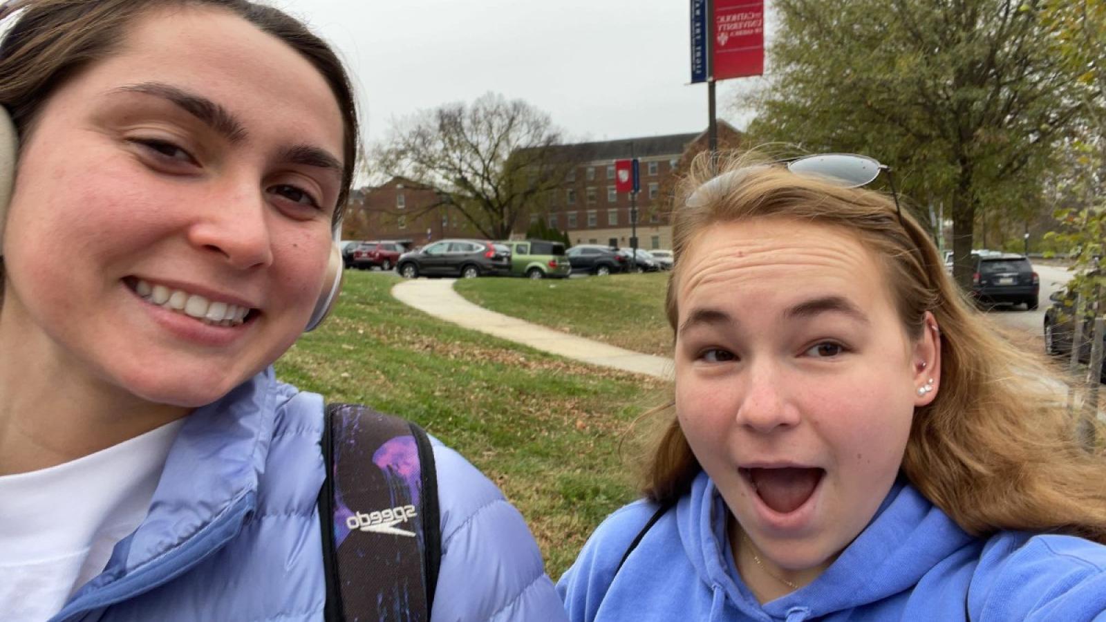 lucy with a friend on campus