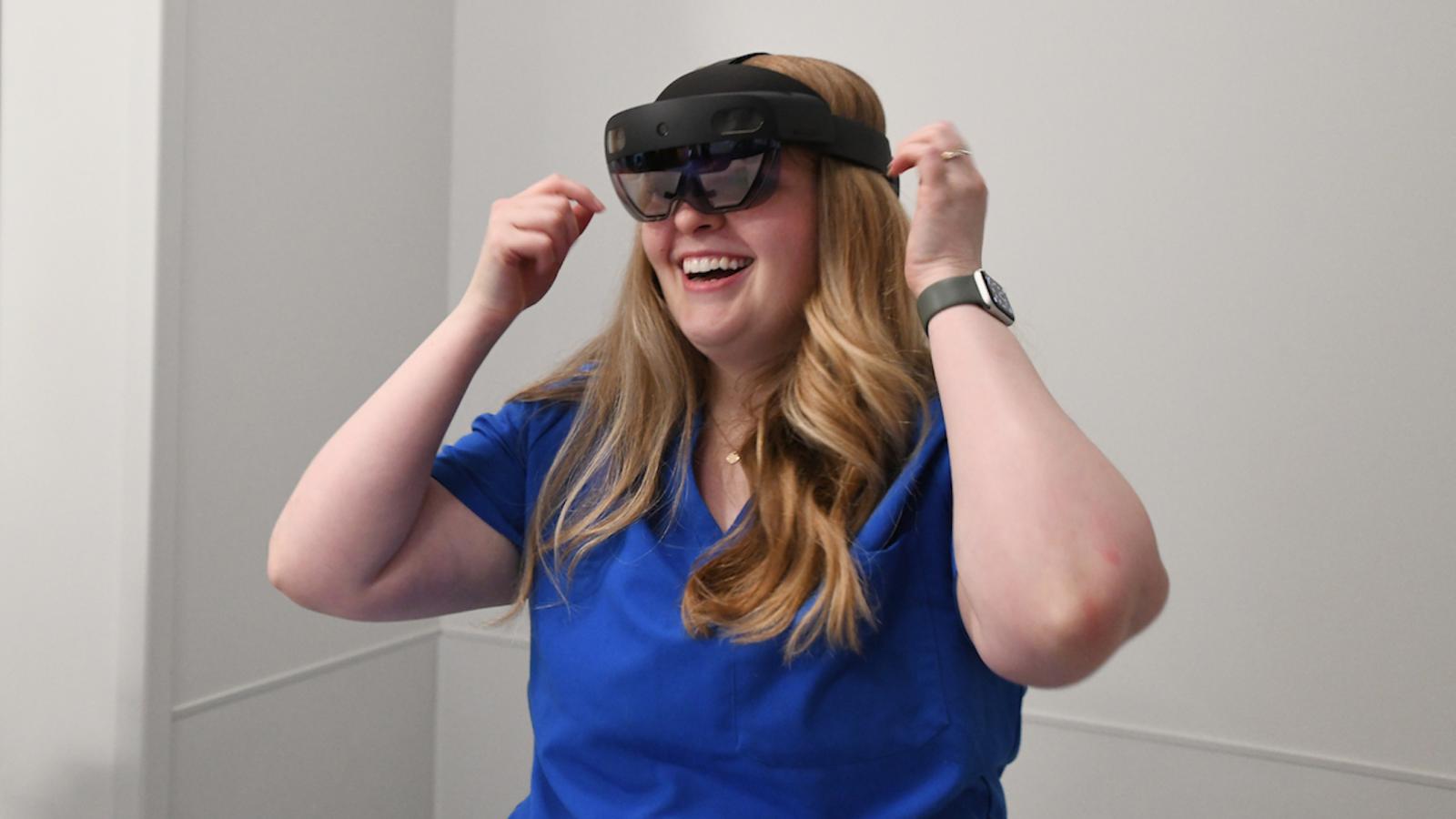 nursing student wearing virtual reality goggles
