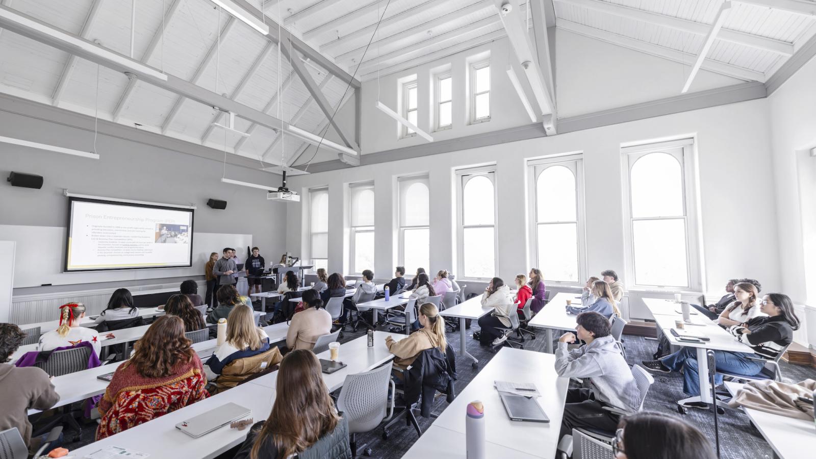 students in a light-filled classroom with vaulted ceilings in the nursing building