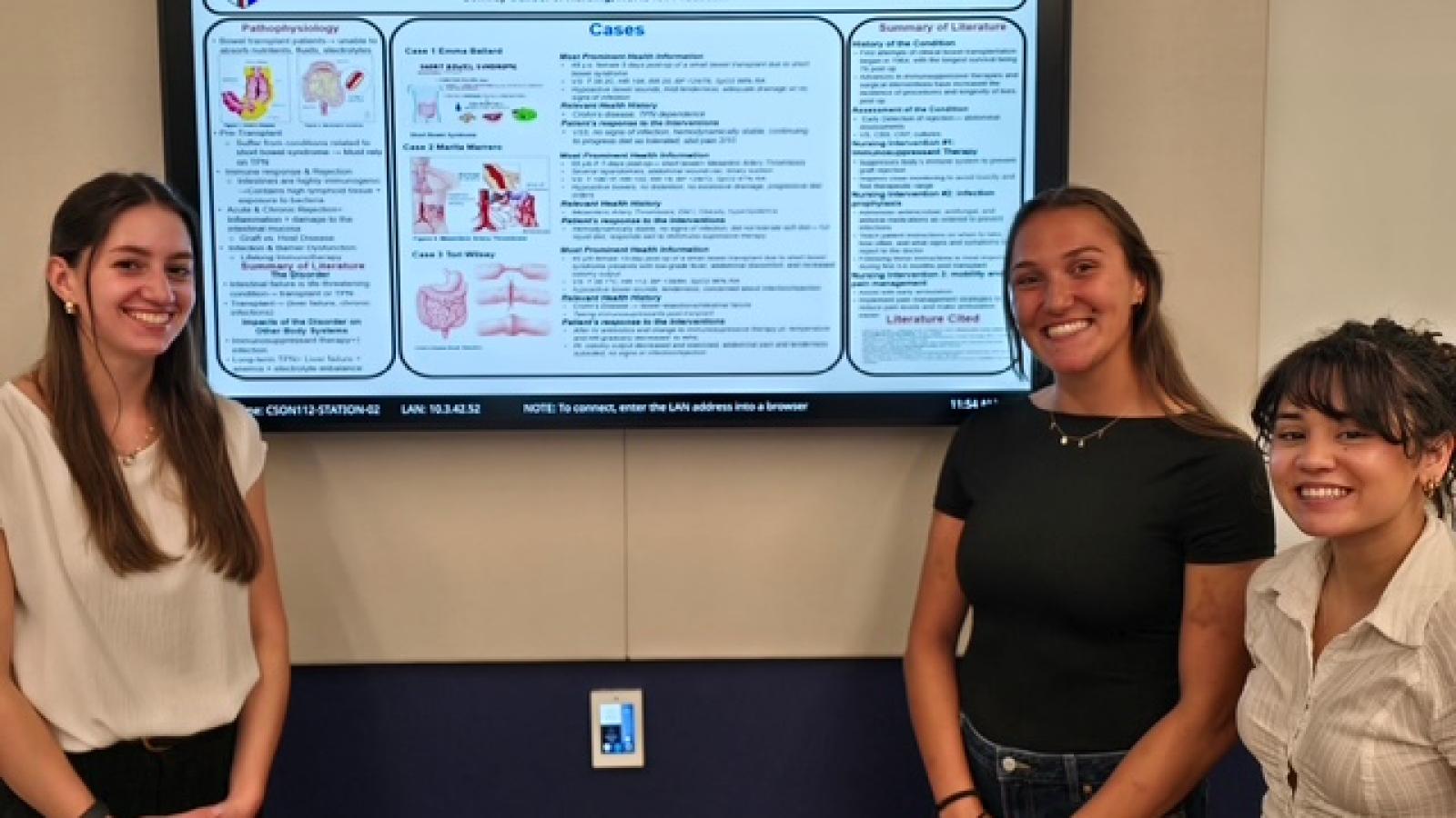 Presentation from 2026 Senior Practicum Presentations, featuring three students including three women.