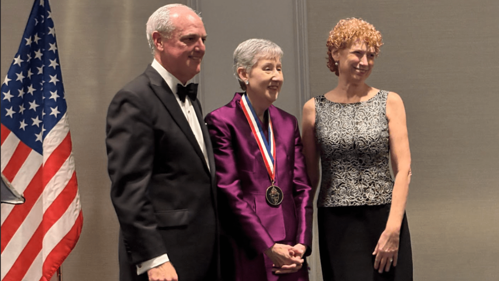 Dean Marie Nolan receiving the medal.