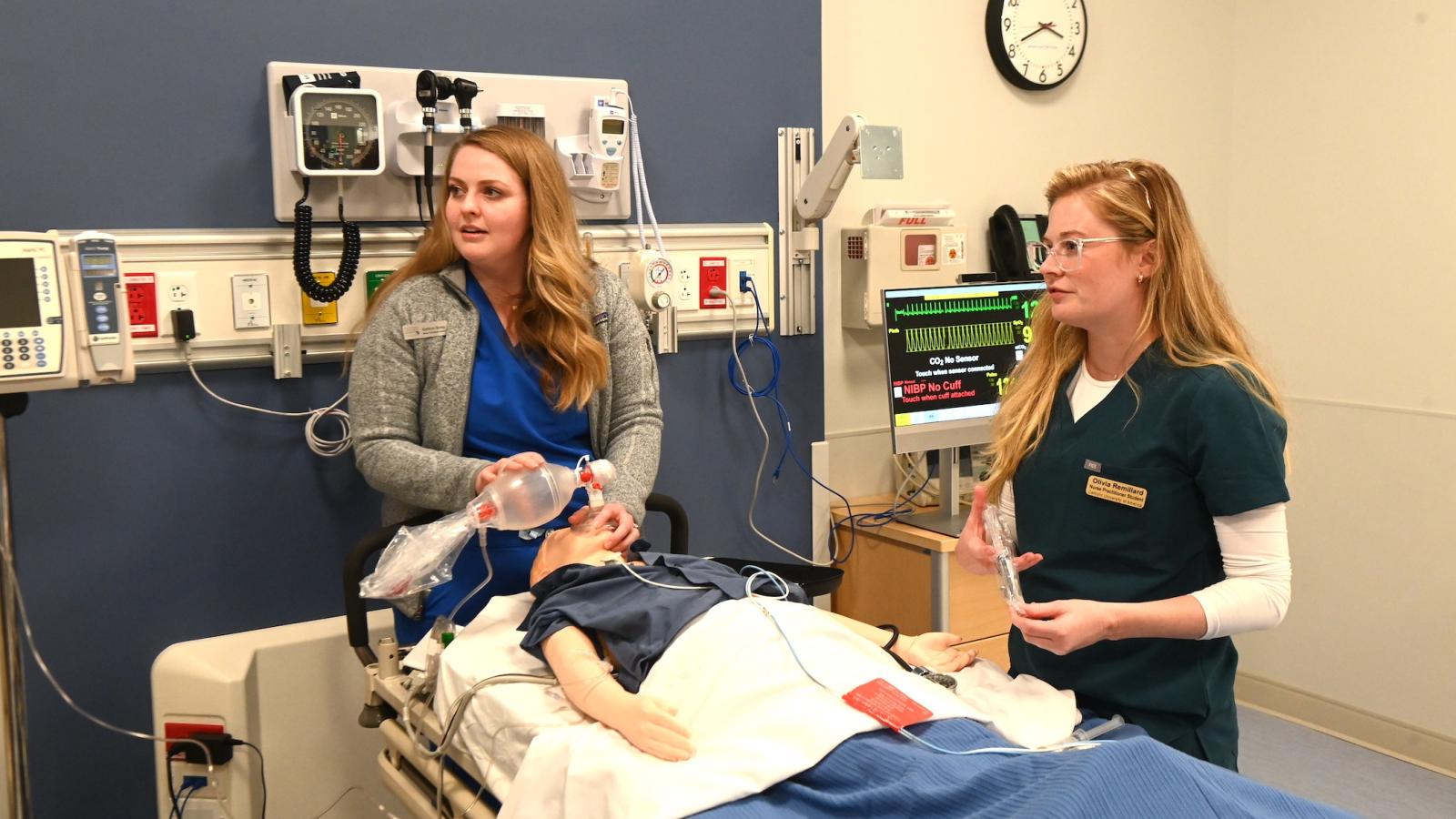 instructors perform a simulation of a pediatric resuscitation