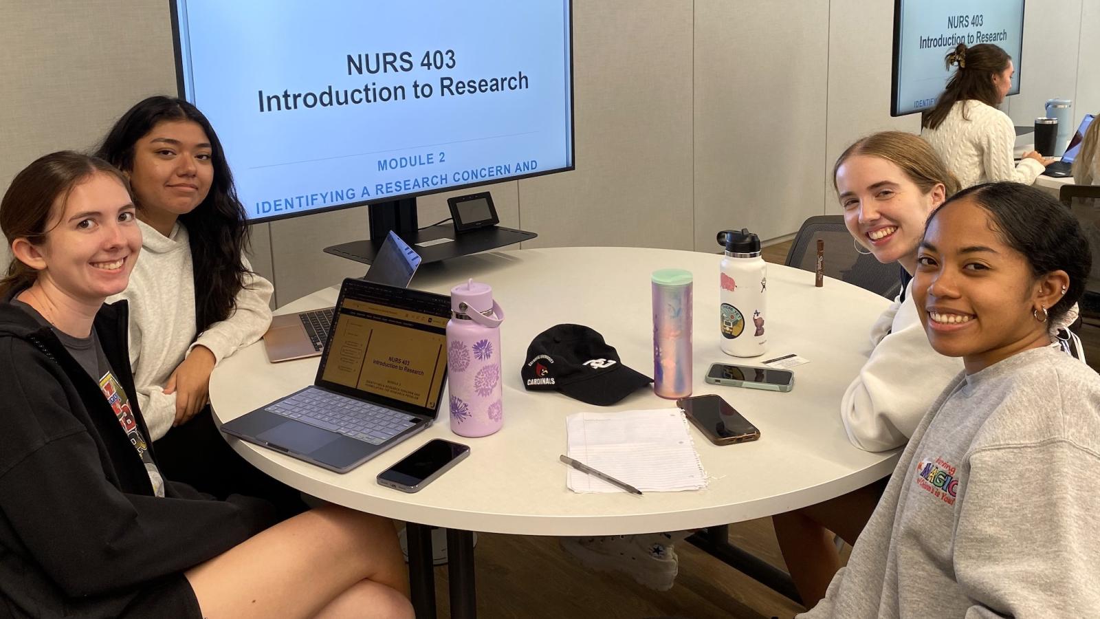 students at a collaborative table in classs