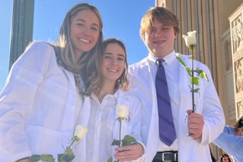 Evan Ampe and friends in their white nursing coats