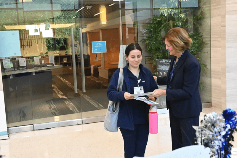 nursing student getting help from an older professional