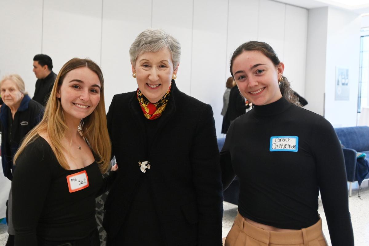 two female alumni pose for a picture with nursing dean marie nolan