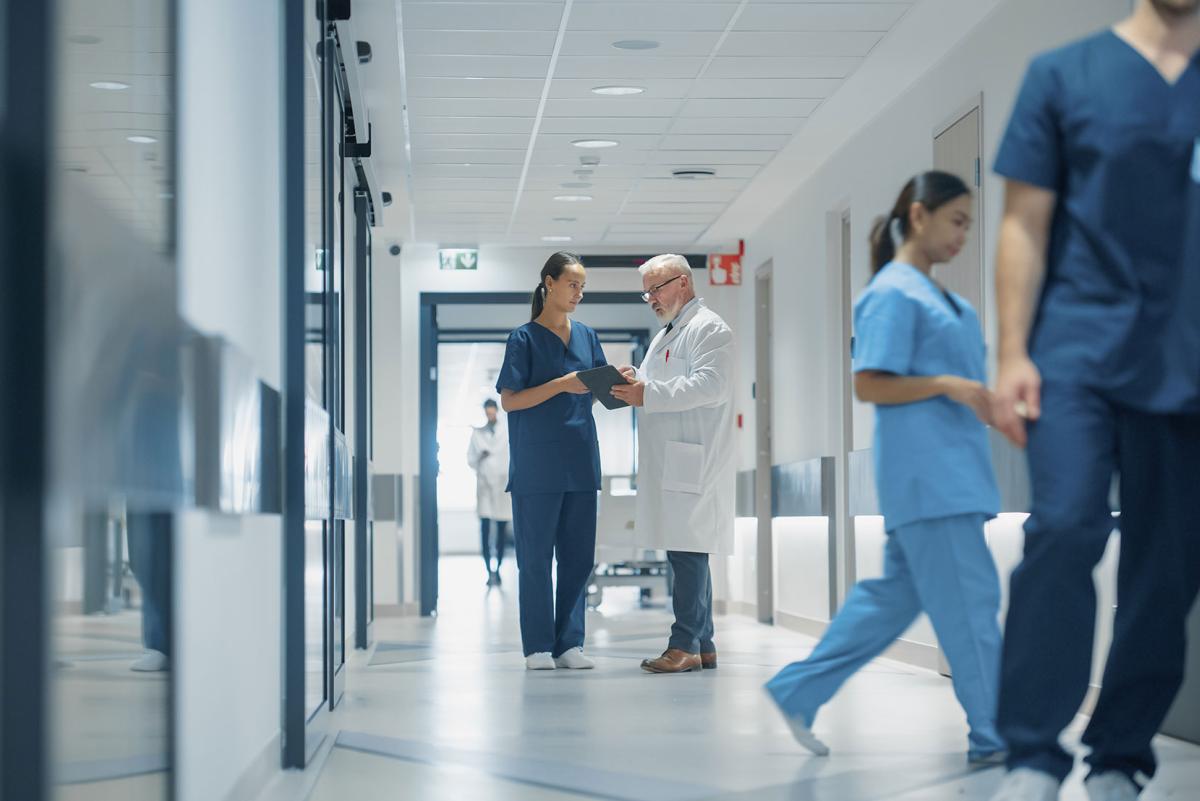 Nursing student in hospital hallway.