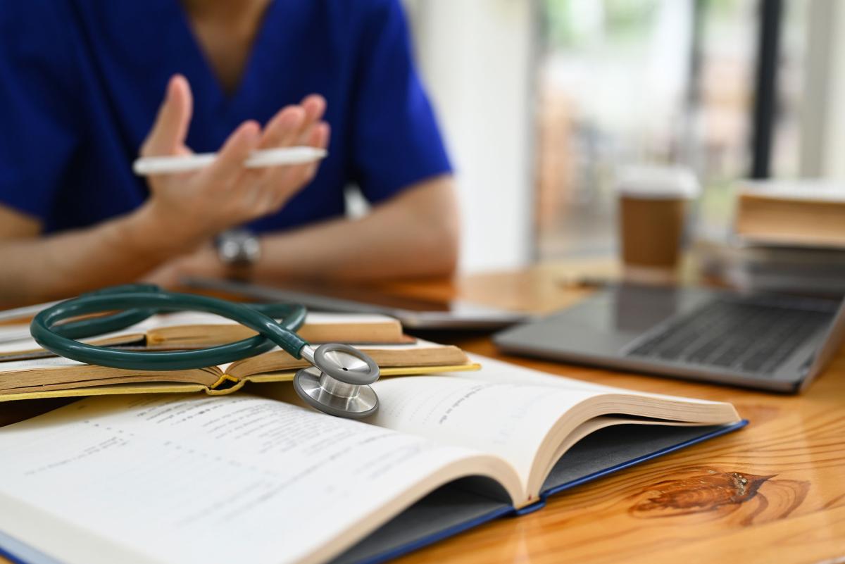 Nurse working at his desk.