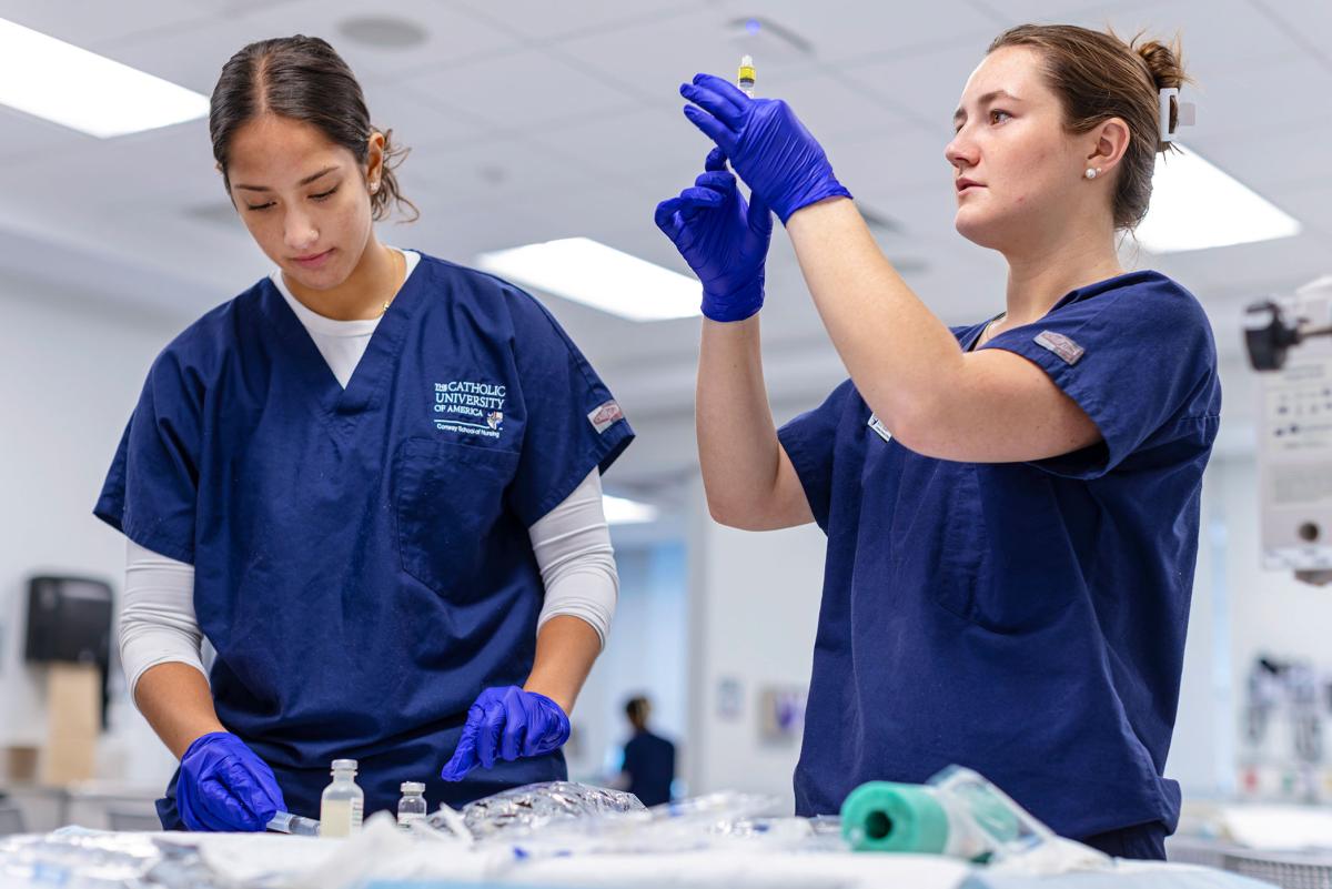Nursing students performing tests in the lab.