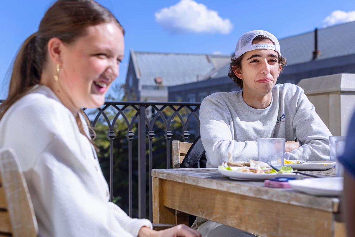Students eating lunch outside.