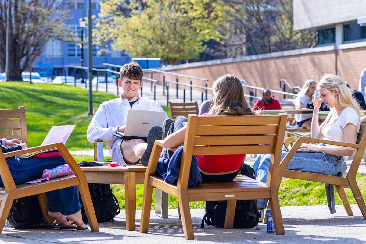 Students studying near the Pryz in the center of campus.