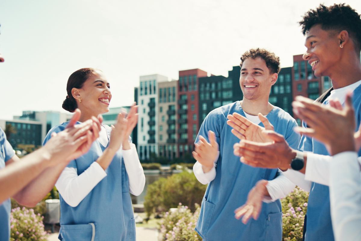 nursing residents smilling and clapping