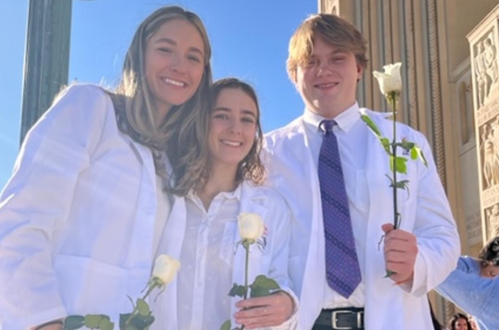 Evan Ampe and friends in their white nursing coats