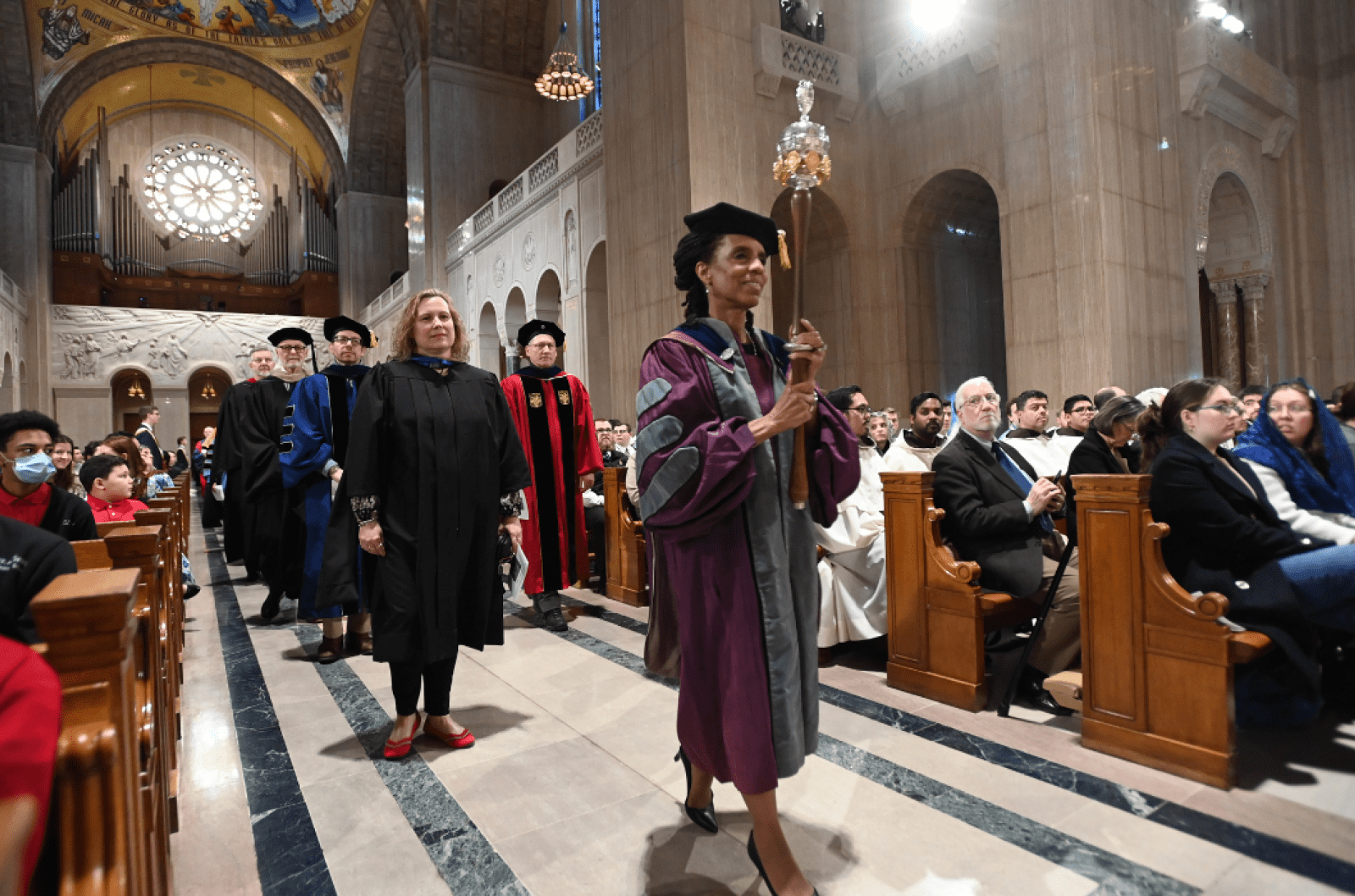 Faculty members leading the procession during the St. Thomas Aquinas Mass.