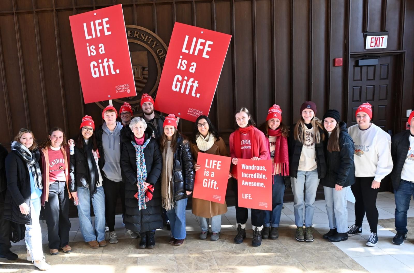 Catholic University students and faculty standing in Heritage Hall before the March for Life.