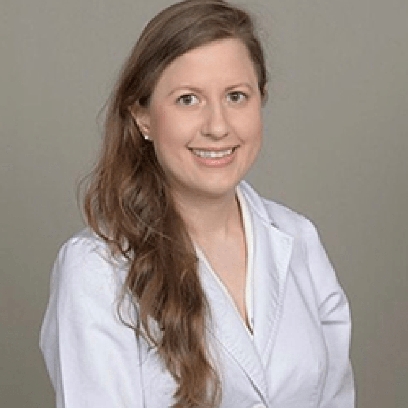 A photo of Salomé Loera. She has long, light brown hair and is wearing a white shirt.