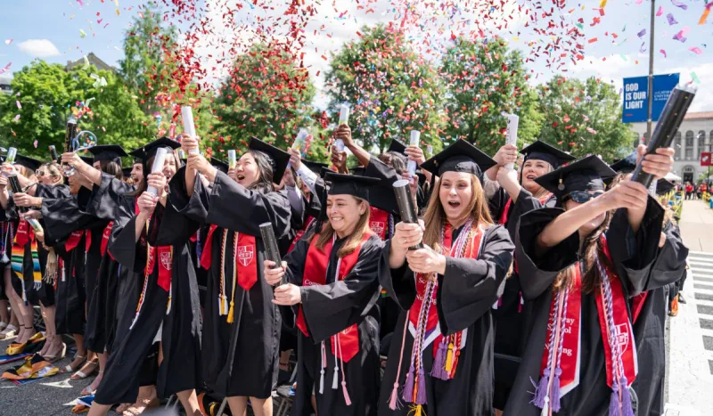 Conway School of Nursing students at their Commencement, popping confetti canons in celebration.