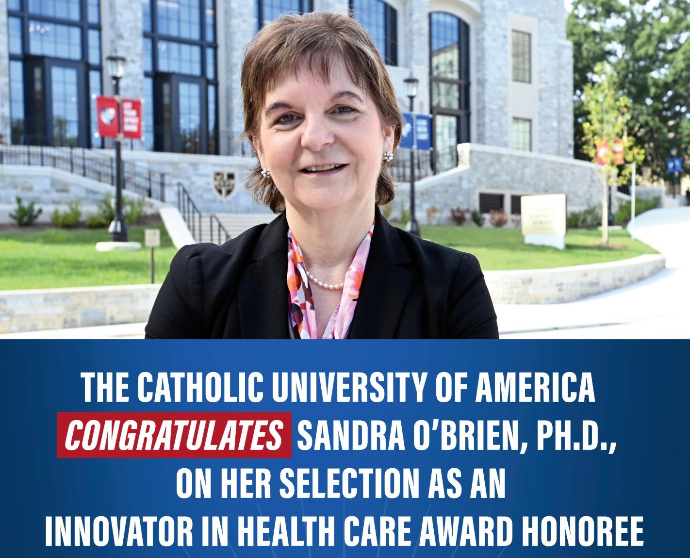 sandra obrien is congratulated for her award